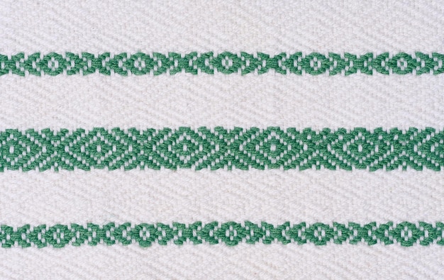 Piece of cotton fabric for making tablecloths and kitchen towels with green embroidered elements