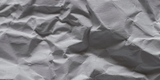 A piece of crumpled paper with a handwritten letter on it