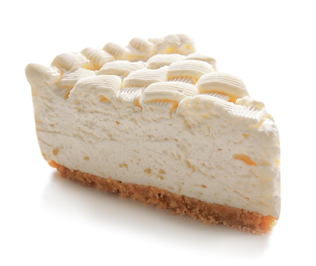 Piece of delicious cheesecake on white background