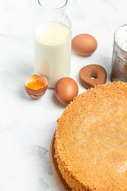 Piece of delicious fresh homemade sponge cake or chiffon cake on light table vertical image