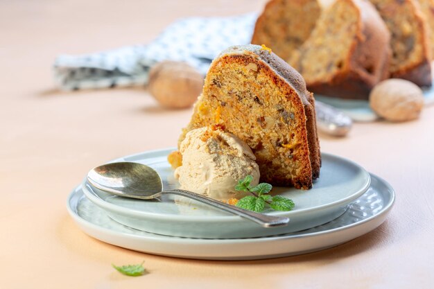 Piece of homemade carrot cake with ice cream