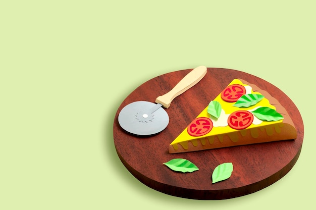 Piece of paper pizza Margherita and pizza knife