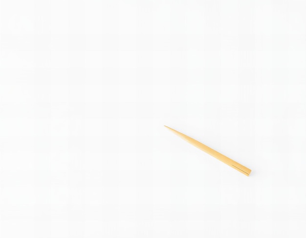 Photo a piece of a pencil is stuck in a white surface