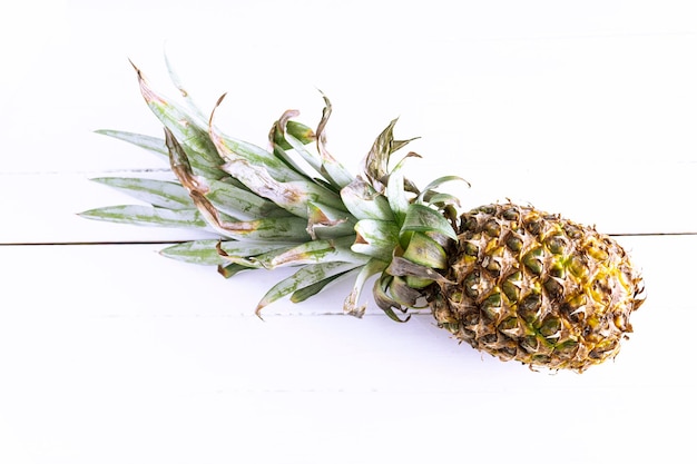 Piece of pineapple on white background Tropical fruit photography with copy space