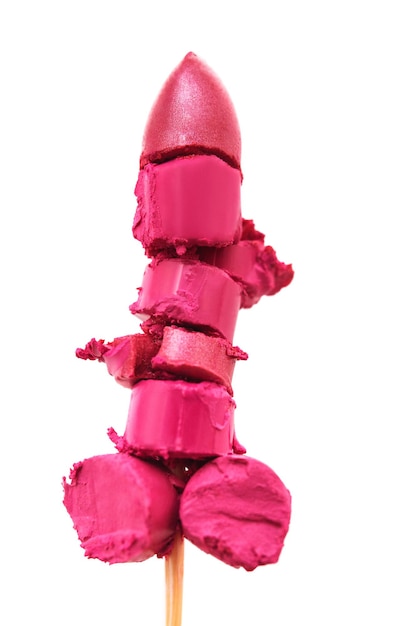 Piece of pink lipstick on wood stick sexy fashion