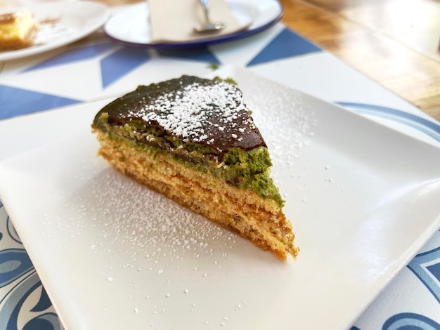 Piece of pistachio cake plated