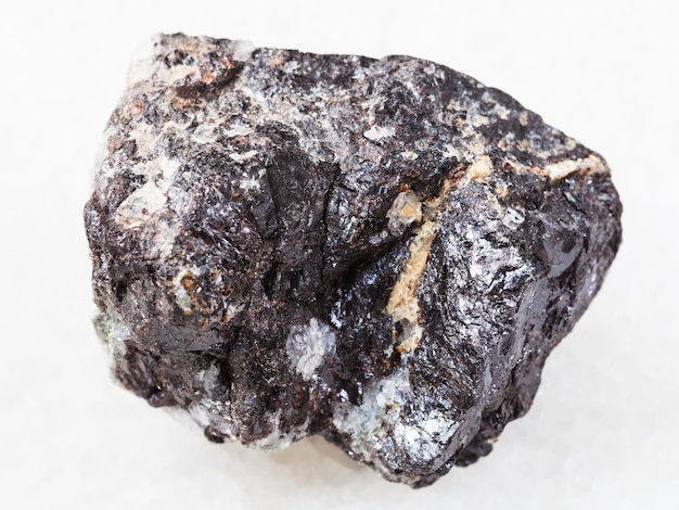 Piece of Sphalerite ore on white marble