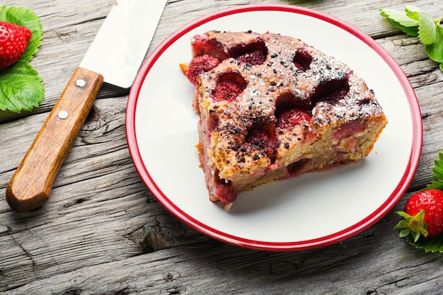 Piece of tasty homemade strawberry pie on a plate