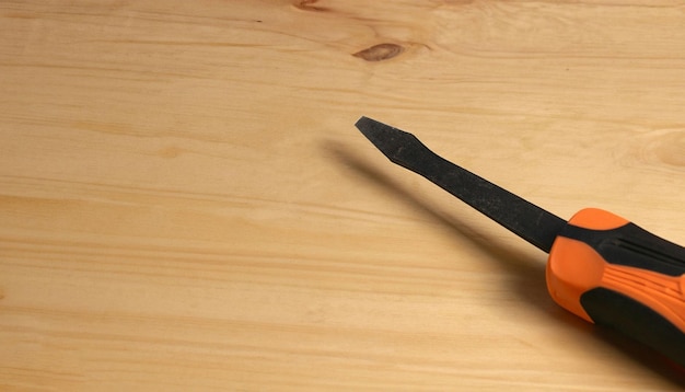 A piece of wood with a black tip on it.