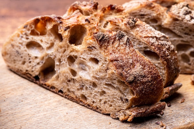 Pieces of buckwheat bread Sliced baguette on a wooden board