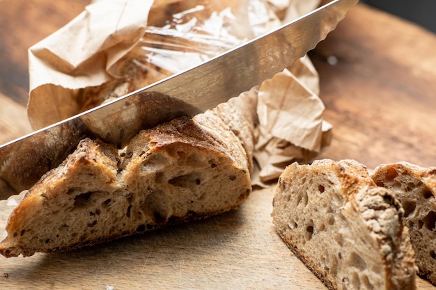 Pieces of buckwheat bread Sliced baguette on a wooden board