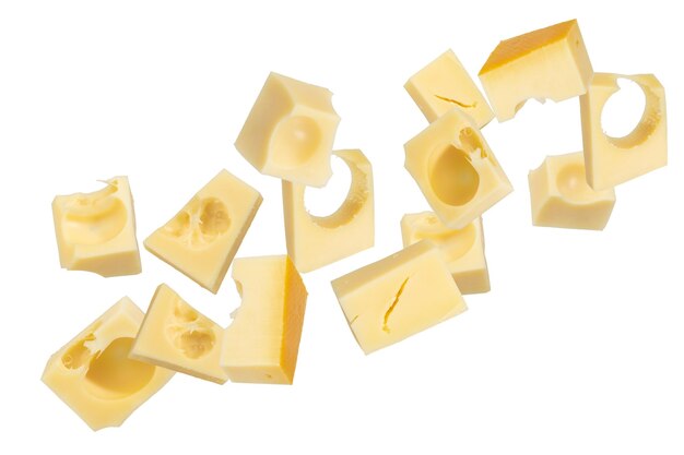 Pieces of emmental cheese on a white isolated background Pieces fly off in all directions To be inserted into a design or project High quality photo