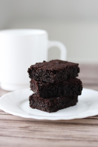 Pieces of fresh brownie on white background Delicious chocolate pie