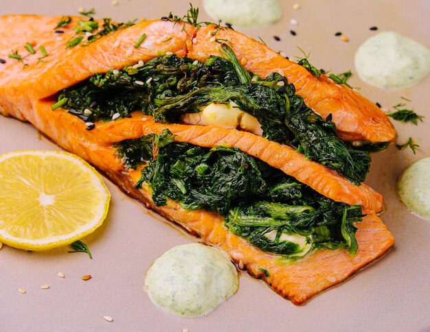 Pieces of fried salmon with dill and lemon