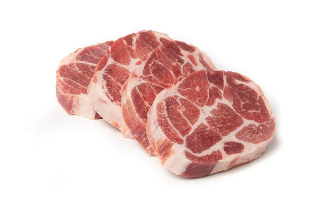 Pieces of marble steak from raw pork or beef on a white background