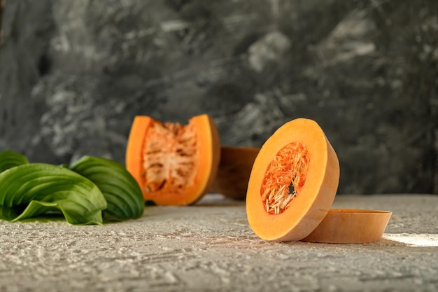 pieces of pumpkin on white concrete pearshaped pumpkin rings homemade vegetables pumpkin photo