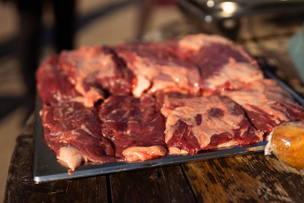 pieces of raw red marinated meat for cooking on fire