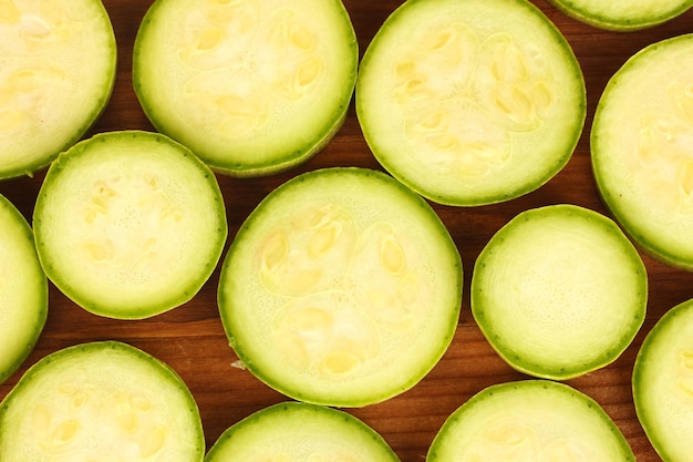 Pieces of squash background on wooden closeup