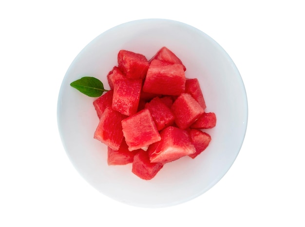 Pieces of watermelon in bowl on white background Top view