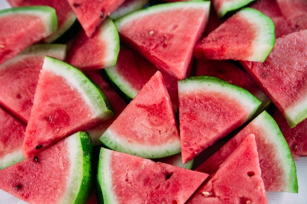 Pieces of watermelon on a wooden table close up