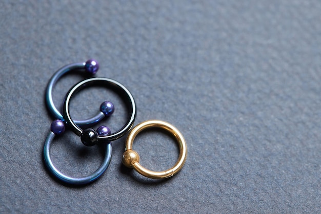 Piercing earrings closeup On a black background