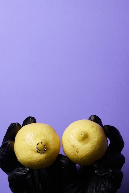 Piercing earrings in a lemon on an background