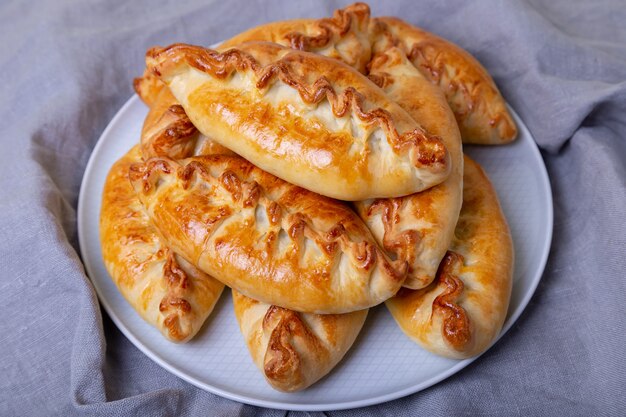 Pies pirozhki with cabbage