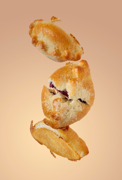 Pies with berry filling on yellow background selective focus flying food