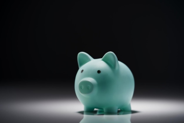 Piggy bank against gray background with copy space