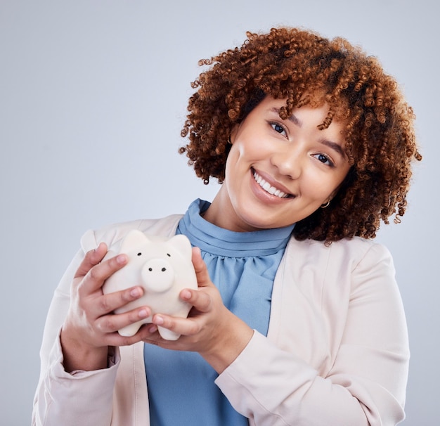 Piggy bank portrait and happy woman isolated on studio white background for savings investment or finance African person or business worker budget financial management and money safe or security