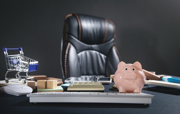 Piggy bank with a shopping cart on the table.