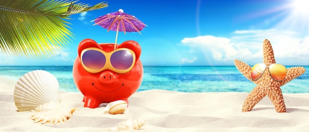 Piggy bank with sunglasses on tropical beach summer holiday