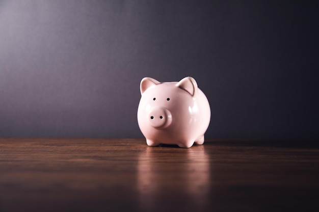 Piggy Bank on the Wooden Table