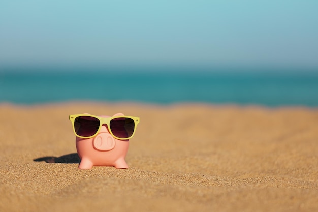 Piggybank on the beach in summer