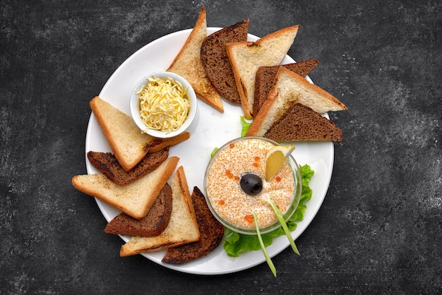 Pike caviar on ice with butter and toast