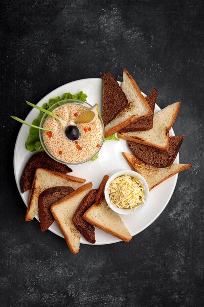 Pike caviar on ice with butter and toast