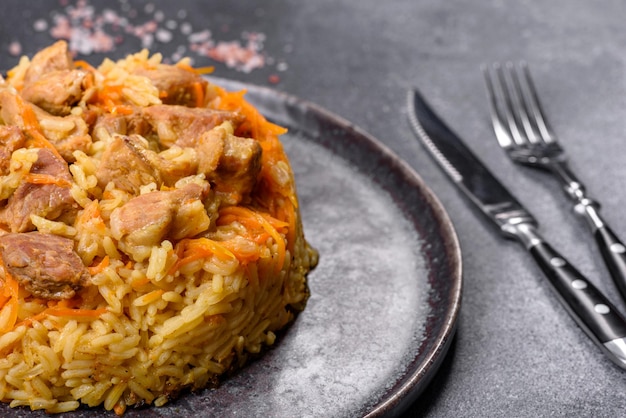 Pilaf or pilau with chicken traditional uzbek hot dish of boiled rice and chicken meat