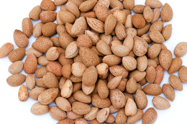 A pile of almonds with the word almond on the bottom.