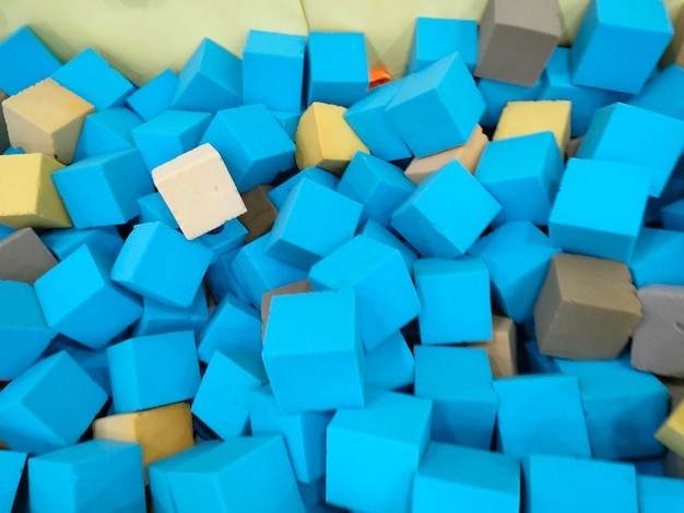 A pile of blue and gray blocks with one that says " z " on it.