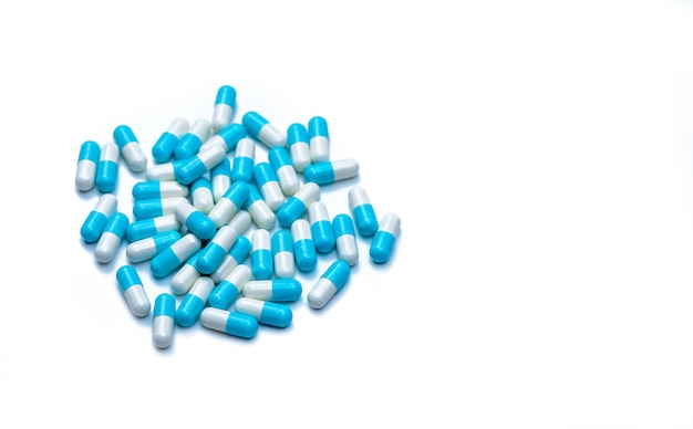 Pile of blue and white capsules pill with copy space