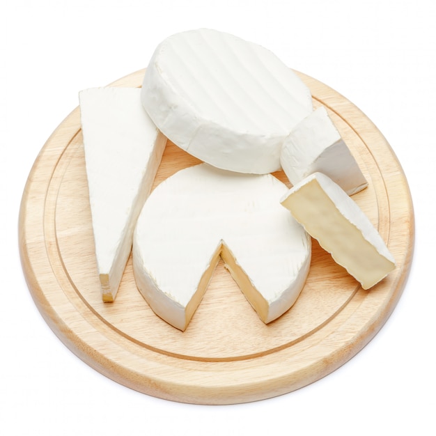 Pile of brie or camambert cheese on white space