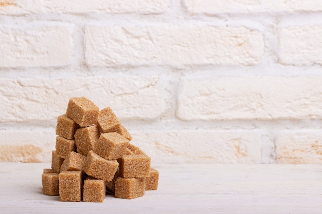 Pile of brown cane sugar cubes