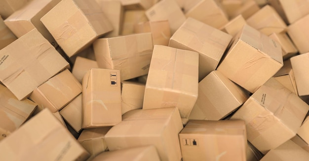 Pile of brown cardboard boxes background header logistics and delivery concept image