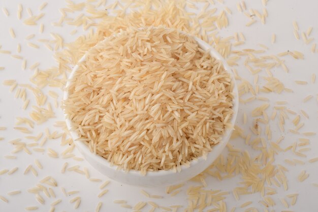 Pile of brown rice on white