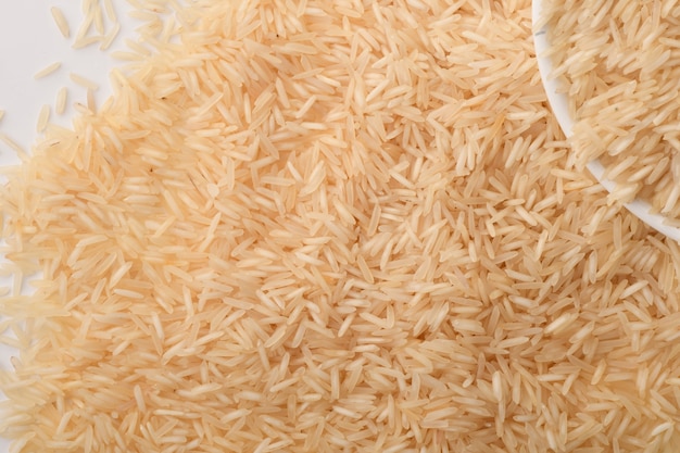 Pile of brown rice on white