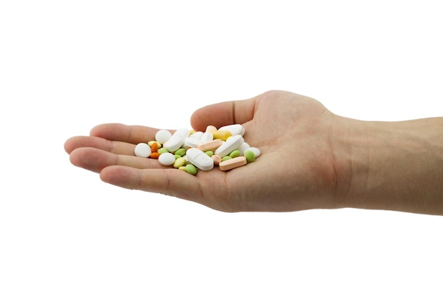 Pile of colored pills on the palm