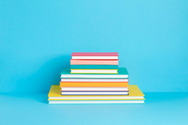 Pile of colorful books and notebooks. Education, study, learning, back to school, teaching concept