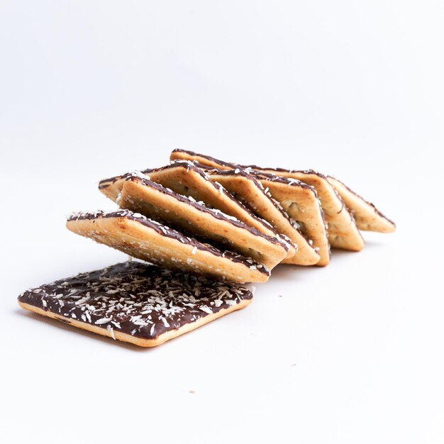 Pile of crunchy coconut chocolate malkist isolated on white background