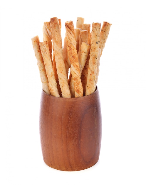 Pile of delicious pretzel sticks isolated on white background