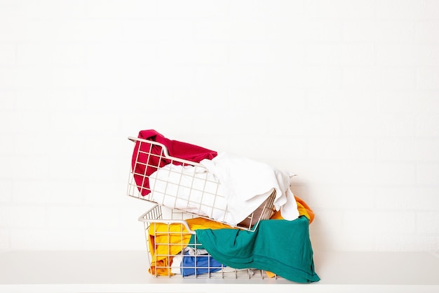 Pile of dirty colorful laundry in baskets